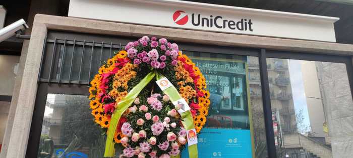 Catania, two wreaths in front of the bank